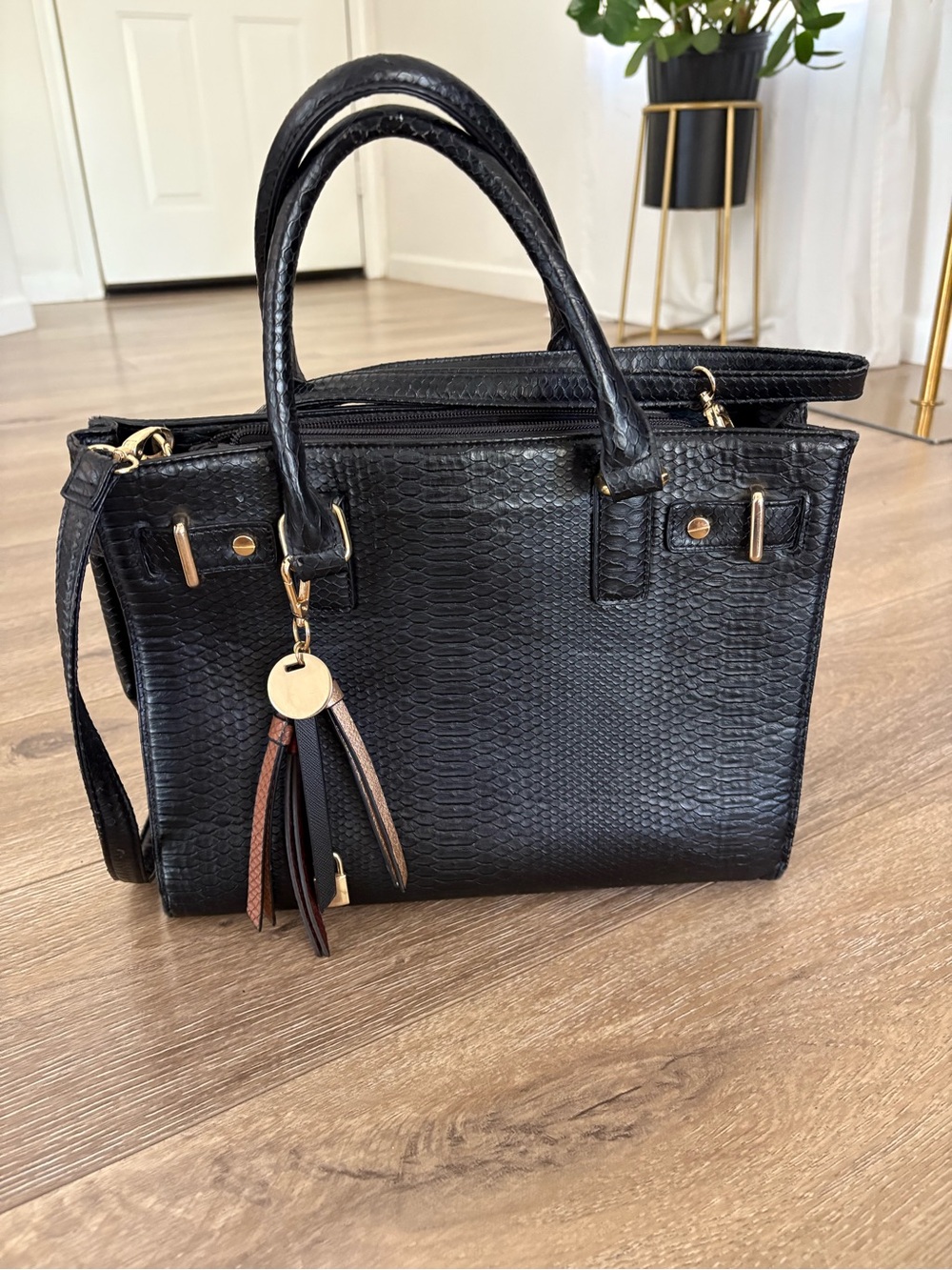 Black Textured Tote Handbag with Tassel Charm